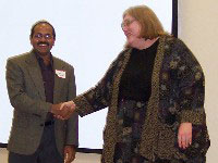 Hemant More, Area C1 Governor, Congratulating Louise Wolfe, Area C1 Toastmaster of the Year