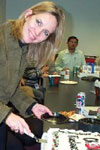 First President and Club Mentor, Beth McElhinney, cutting cake for CH@Home's First Anniversary, Dec. 2000