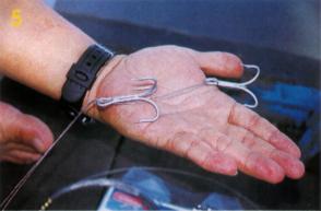 How to rig a tongkol rigs - Thread the end of the wire through the fishing gill.