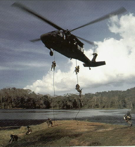 [SEALs rappel (fastroping you politicaly correct bastards) :) to the ground from an Army UH-60 Black Hawk helicopter during training in Panama]