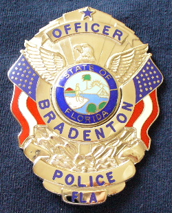 Bradenton Fla,. Police Office badge. Hallmarked "Signature" this is an awesome looking badge with great flag detail on the sides