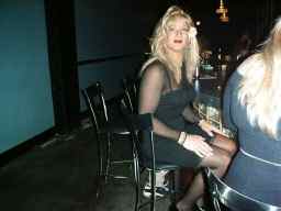 the beautiful Haley sitting at the bar at the Joy Club