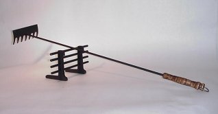 a new ember rake and ember gate ready to work in YOUR woodstove!