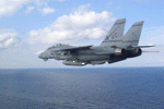 VF-32: F-14 flying low alitude over the ocean.