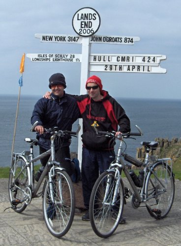 [ Roberto and Gary by a sign-post at Land's End ]