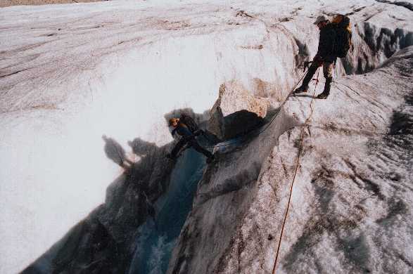 Robert belayed by Larry while Crossing a Glacial River