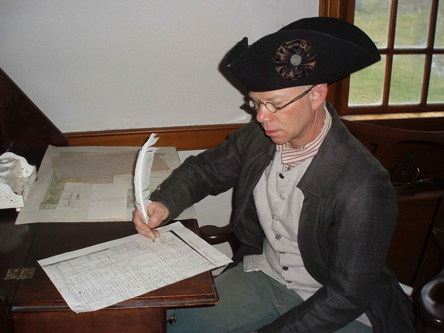 Mr. Madison sitting at Gen. Herkimer's desk reviewing documents taken for Mr. Jenks in 2015