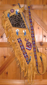Plains Quiver with abalone, medicine pouch, turkey feathers.