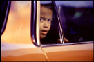 Boy in a car.