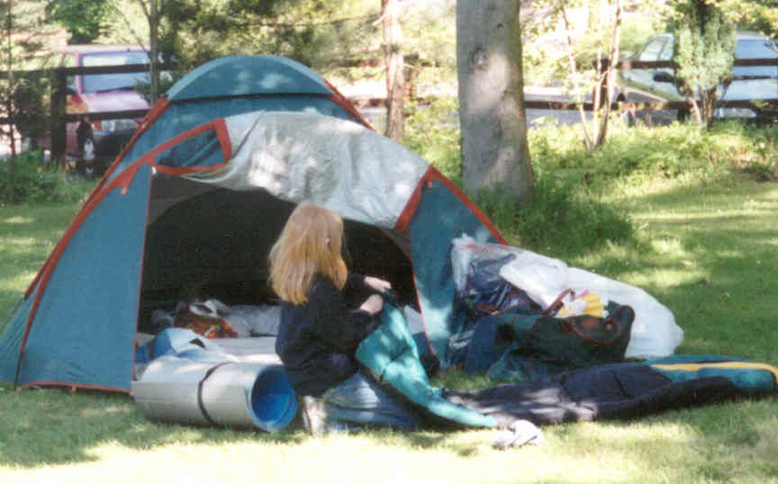 Lottie outside her tent