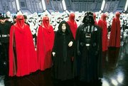 Emperor Palpatine and , along with several  standing at attention aboard the second 