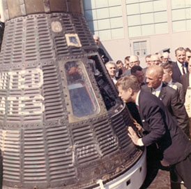 President Kennedy with John Glenn examining the Friendship Seven space capsule, 1962