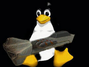 TUX SPORTING A STATE OF THE ART DEFRAGMINTATION GUN!