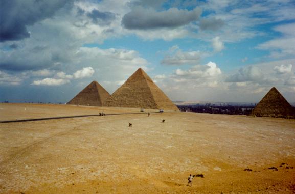 The three great pyramids with Cairo in the background
