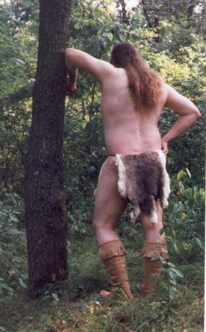 Rabbit skin loincloth, outdoors, standing rear view