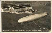 A German postcard showing the GRAF ZEPPELIN over its home port of Friederichshafen.  Click to see the full-size postcard.