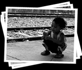 kid holding a flower.(Photoshoot @ the tracks in Sta. Mesa)