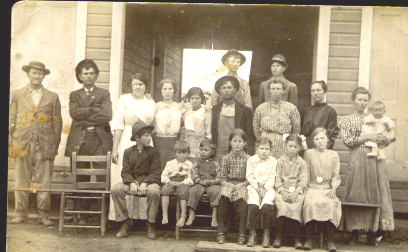 W.C Edmondson is in the middle, daughter Pearl is the woman to the left ...